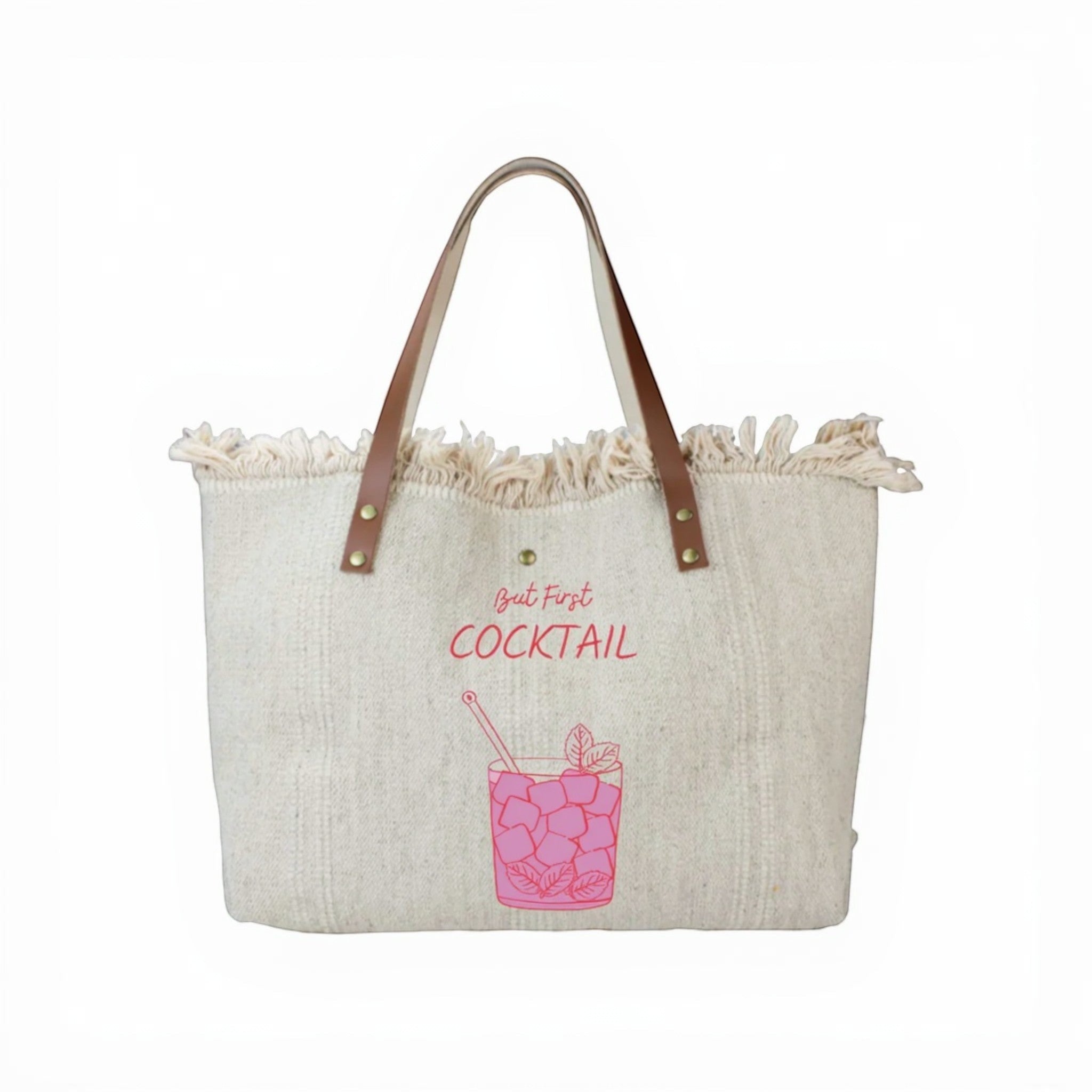 Cabas en coton beige avec anses en cuir, motif cocktail rose et finitions à franges, style bohème chic.