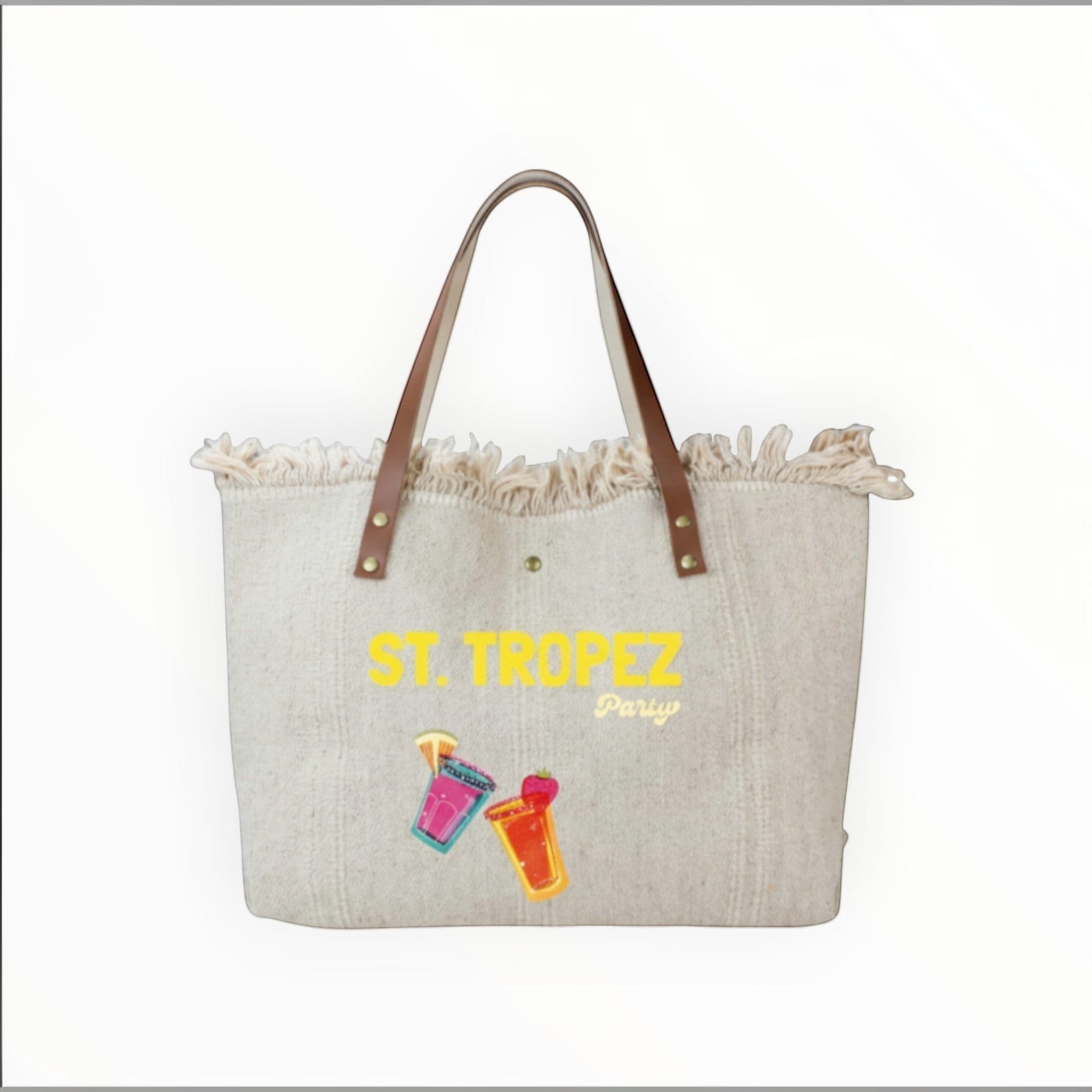 Grand sac cabas de plage  en toile naturelle avec anses en cuir, bords effilochés et motif St. Tropez Party.