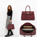 Grand sac à main professionnel  en cuir grainé bordeaux avec finitions dorées, idéal pour ordinateur et bureau.