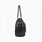 Sac de cours BROCK GALLANTRY noir en simili cuir brillant, format A4 avec anses et fermeture zippée.
