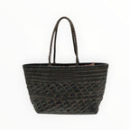 Grand sac shopping  Louisa Lee en cuir tressé noir, style bohème-chic avec anses tressées, fabriqué en Italie.