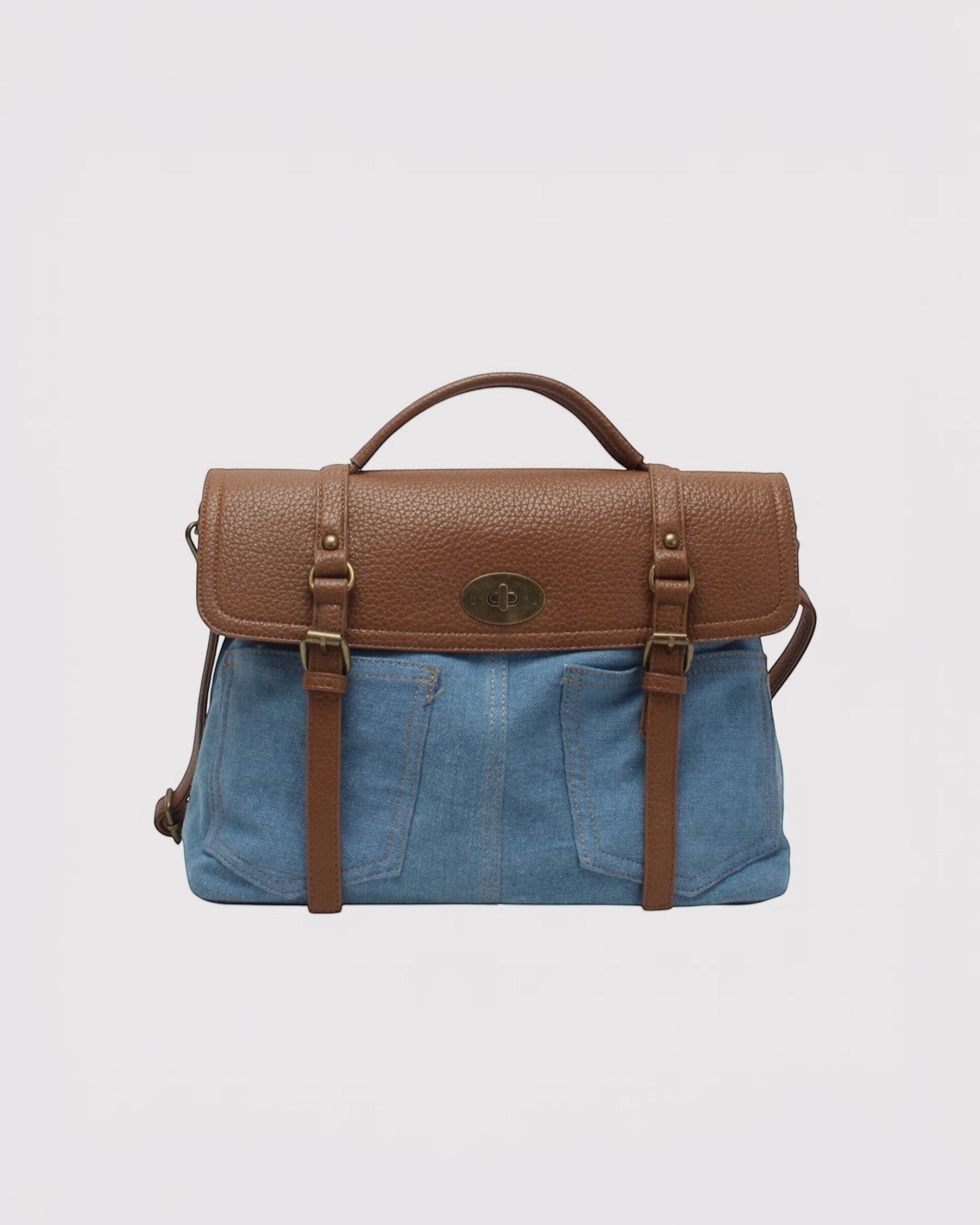 Sacoche bandoulière  en toile denim bleu et similicuir marron, style cartable vintage avec fermoir.
